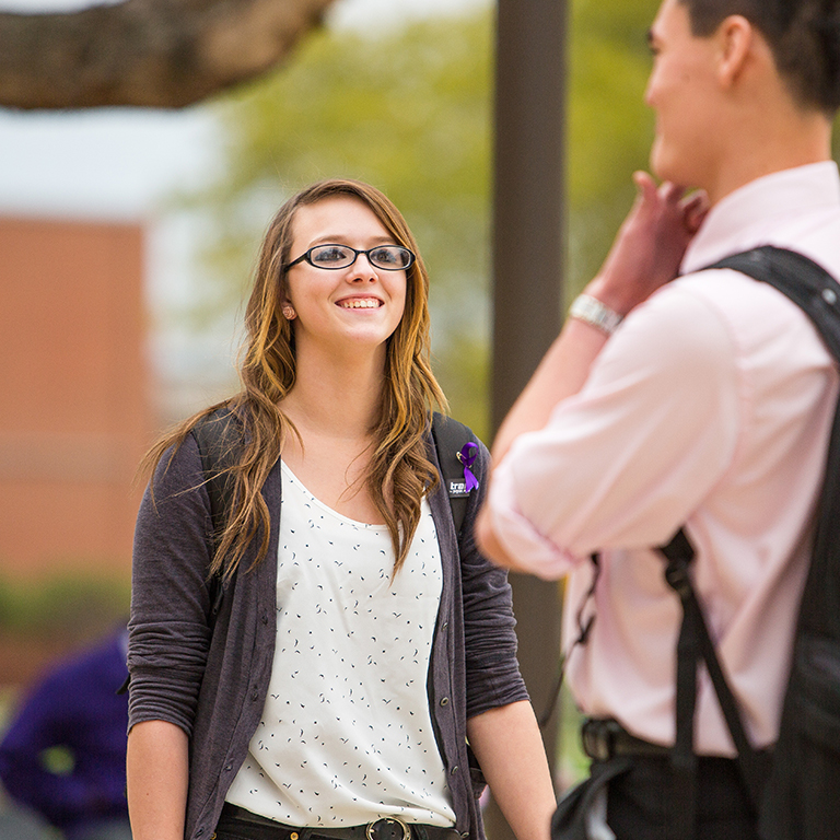 Two students talk.